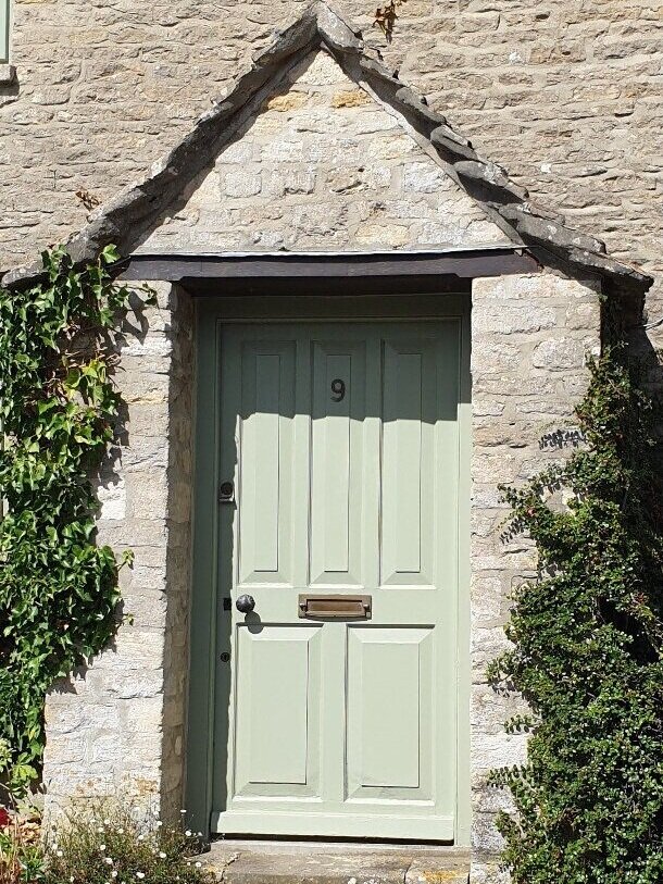Green door of a Cotswold property